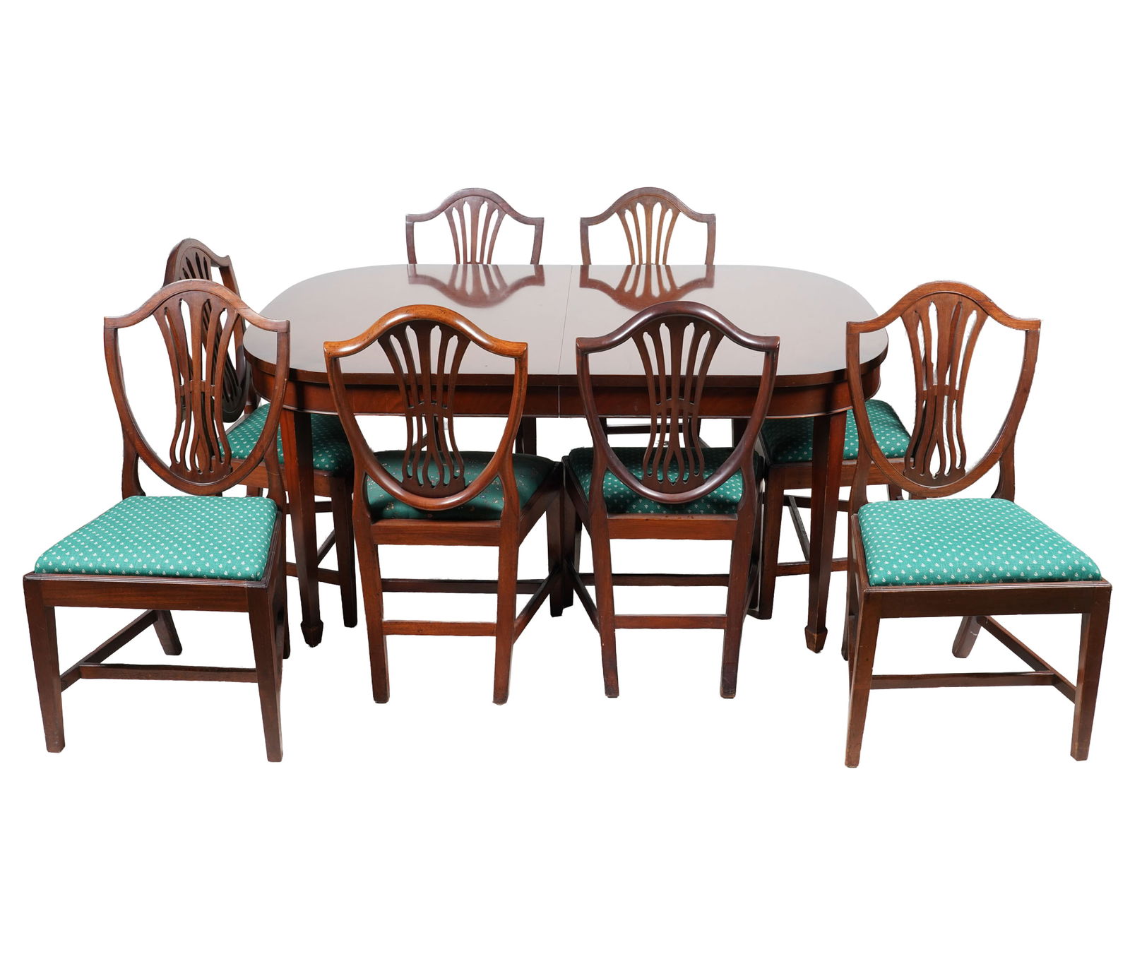 English Mahogany Dining Set: comprising a table (29 1/2 x 64 1/2 x 44 in.) with three leaves (each 12 in. wide), and eight chairs (38 x 20 1/2 x 17 in.)