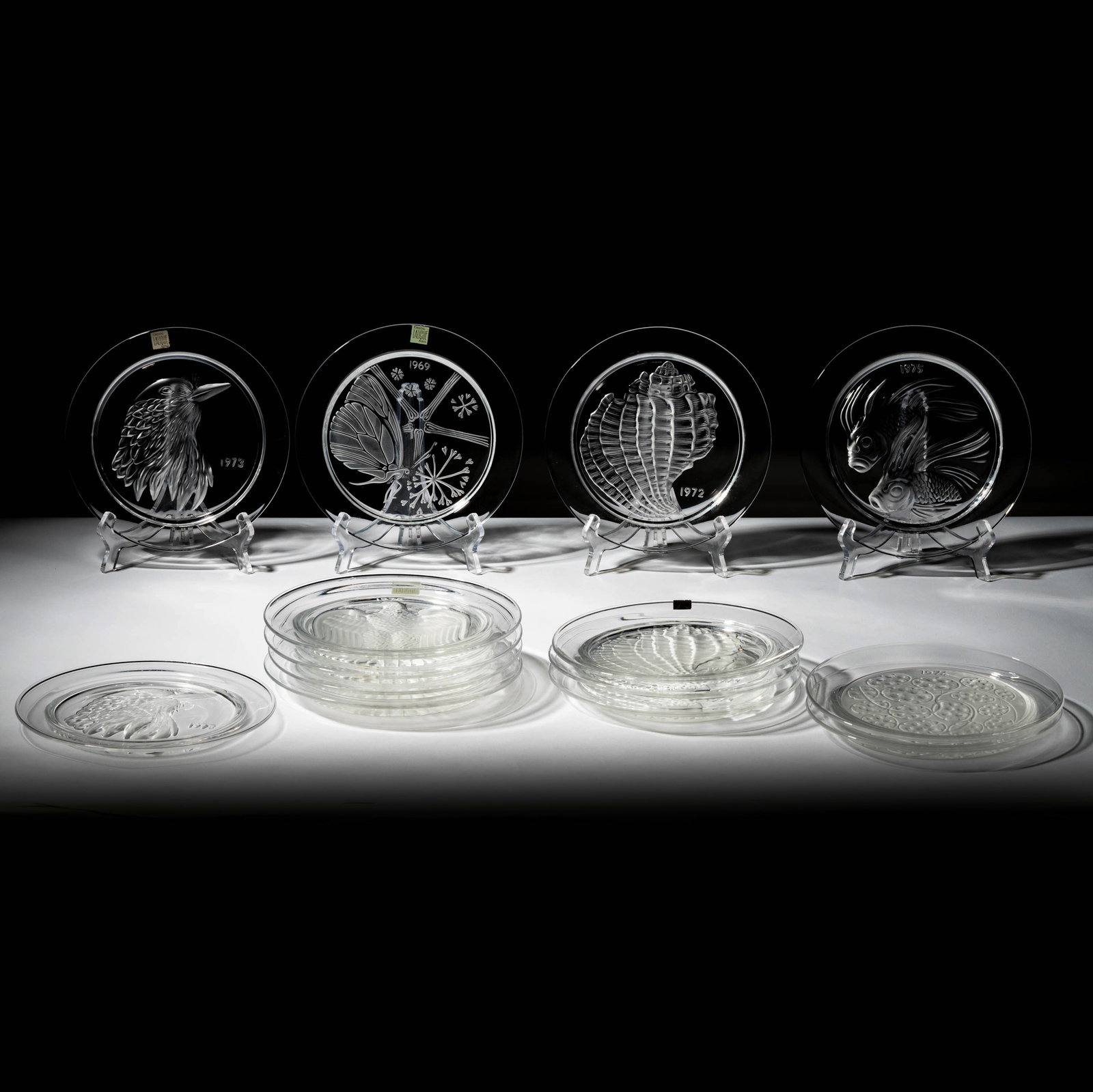 Set of 14 Lalique Glass Annual Plates: each signed "Lalique France" 8 1/2 in. (21.6 cm.) dia.