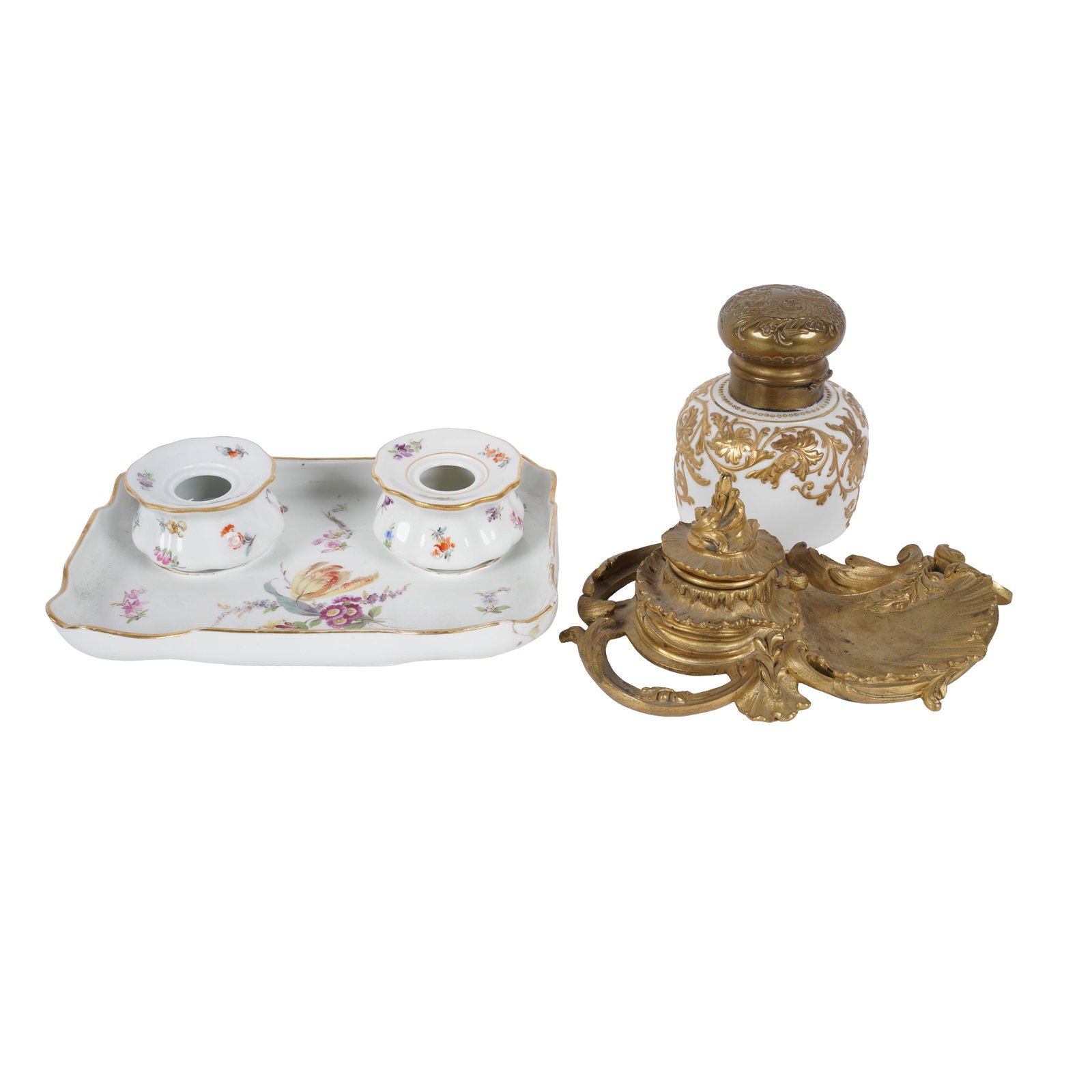 Group of Continental Porcelain and Gilt Metal Inkwells: the first: porcelain painted with scattered flowers, with Meissen-style blue crossed swords mark (Tray: 8 1/2 x 6 in., Each ink pot: 1 3/4 in. high); the second: brass-mounted porcelain, painted with