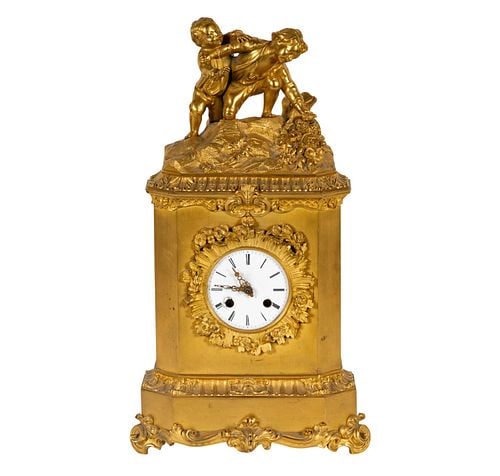 A Gilt Metal Mantel Clock: A Gilt Metal Mantel Clock with replaced late movement marked "Synchron" 17 1/2 x 9 1/2 x 4 1/2 in. (44.5 x 24.1 x 11.4 cm.)