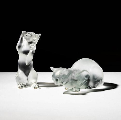 Two Lalique Cat Sculptures: standing cat: 8 x 3 1/2 x 3 1/4 in., prone cat: 5 x 9 x 4 1/2