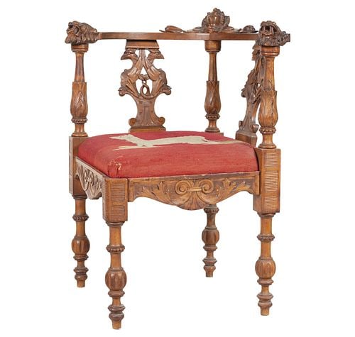 A Continental Carved Oak Corner Chair: with needle work upholstery, 28 x 27 in., seat height: 19 in.