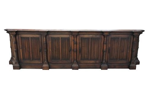 A Carved Fruitwood Sideboard: 33 x 125 x 17 1/4 in.