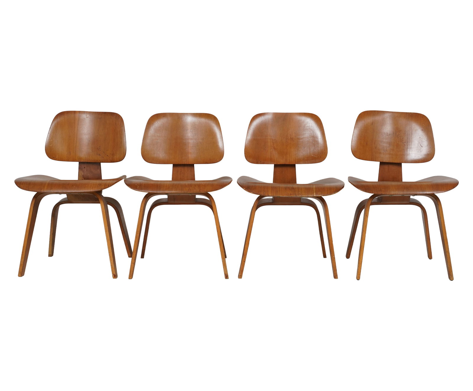 Charles Eames for Evans, Set of Four DCW Chairs: Zeeland, MI, 1947-1950; bent plywood; each with foil label "Manufactured by / Evans Products Company / Molded Plywood Division / Herman Miller / Furniture Company / Sole Distributor / Designed by / Ch