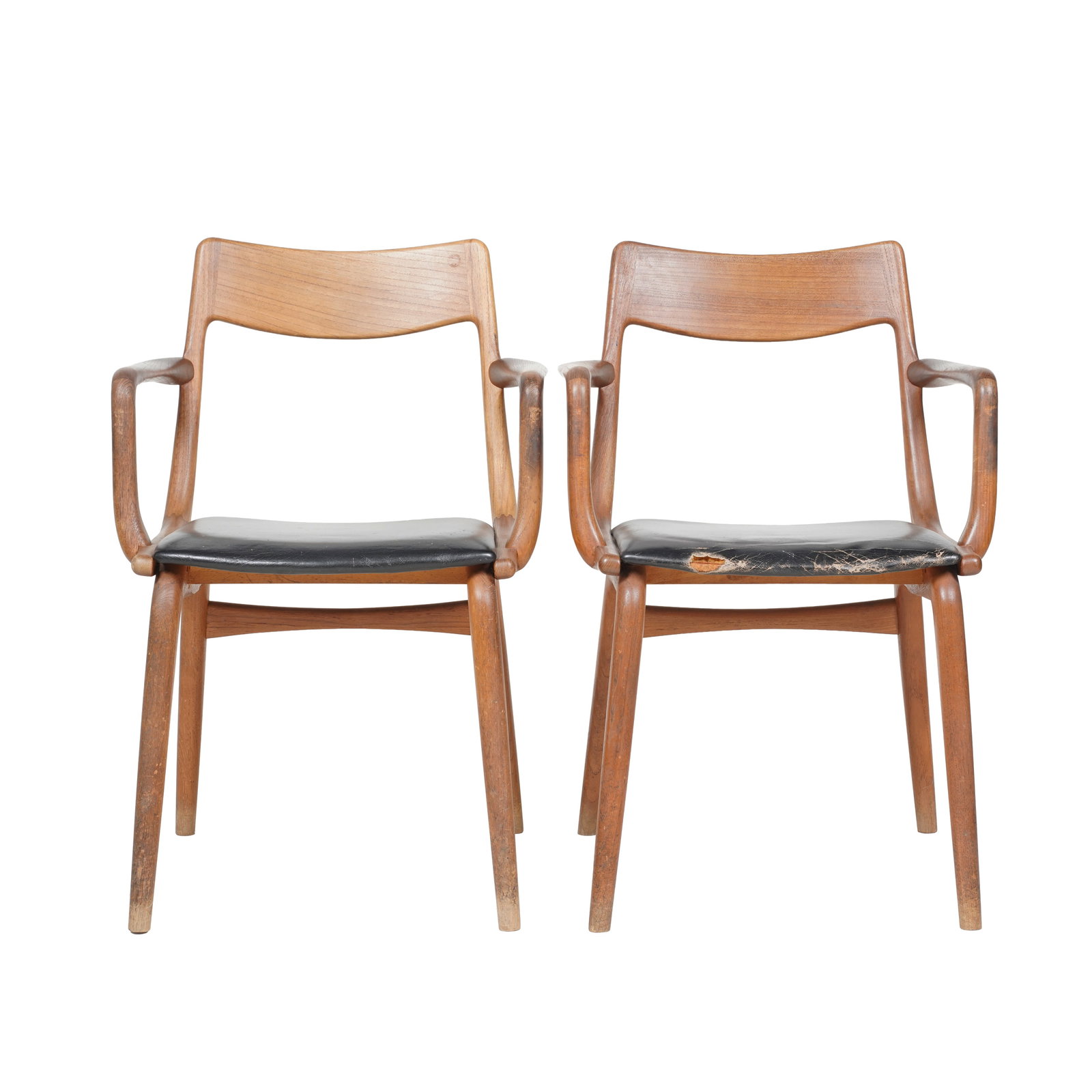 Alfred Christensen, Two Teak Boomerang Armchairs: Denmark, 1960s, with paper label "Made in Denmark / No. 370", 32 x 21 x 19 in., seat height: 17 1/2 in. Provenance: The Los Angeles Estate of Otto and Gail Natzler, the personal residence of Otto and