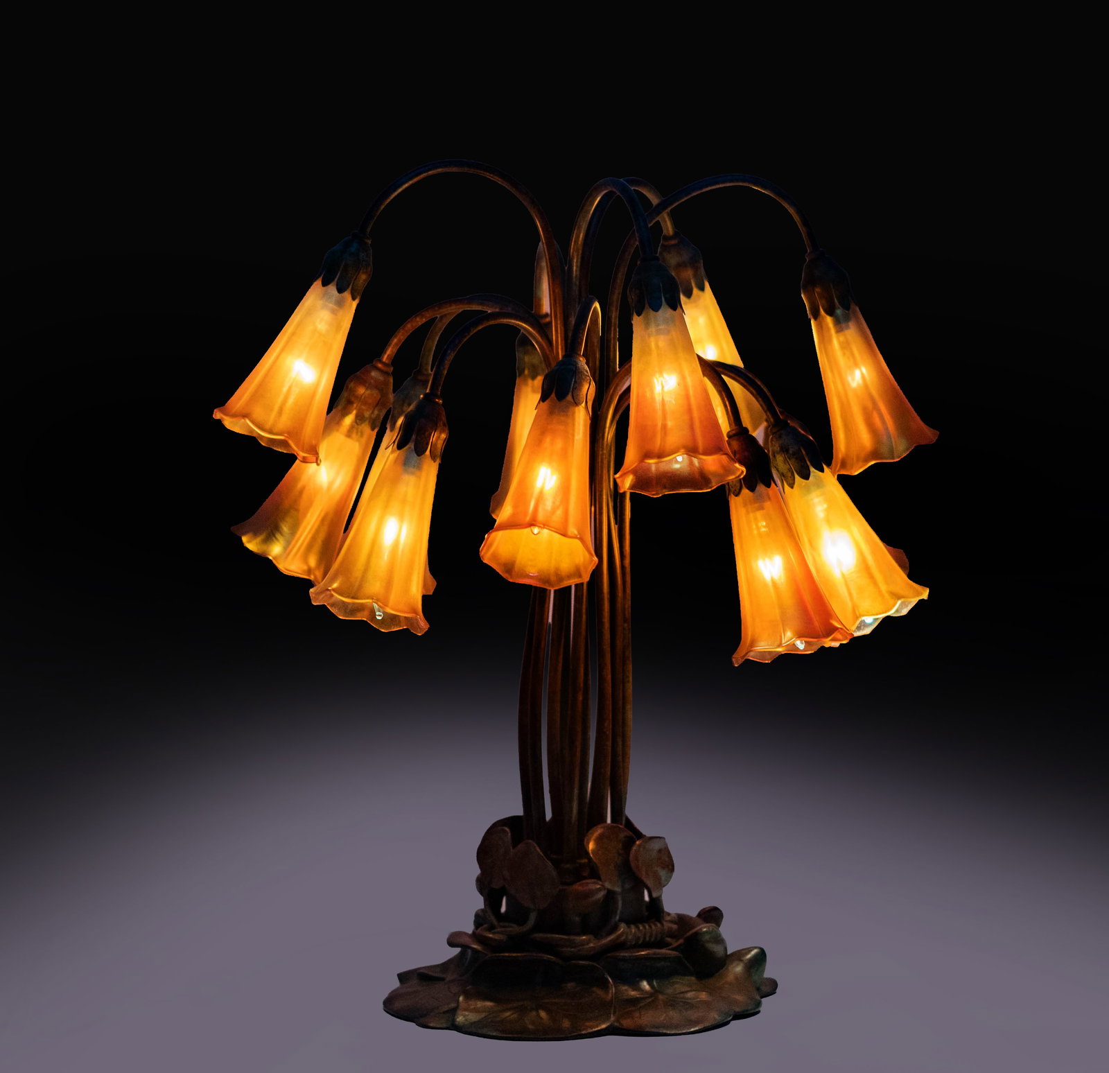 Richard Perry's Tiffany style Lily Lamp with Lundberg Shades: signed to shades, 20 1/4 in. high, Provenance: The Estate of Legendary Music Producer Richard Perry, Los Angeles, CA