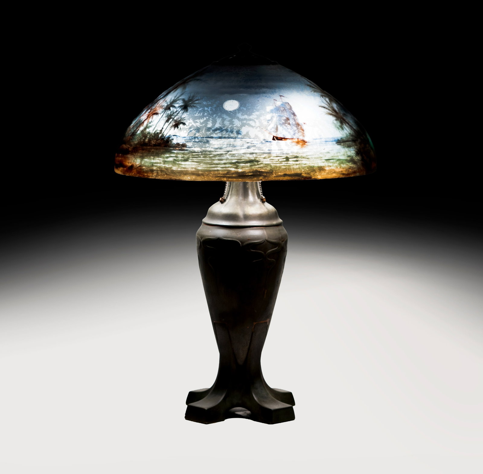 Handel Treasure Island Reverse Painted Table Lamp: signature to top of shade, overall: 26 x 18 in., Provenance: The Estate of Legendary Music Producer Richard Perry, Los Angeles, CA