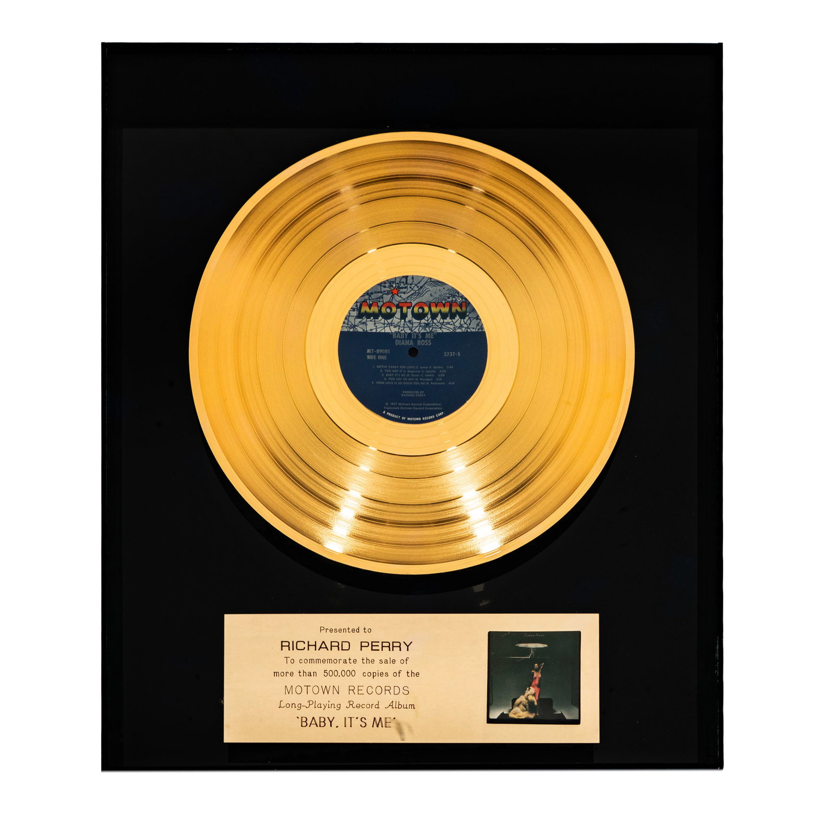 Richard Perry Gold Record Diana Ross's 'Baby It's Me': A gold record award presented to Richard Perry commemorating the sale of over 500,000 copies of Diana Ross's Motown Records long-playing album 'Baby, It's Me'. The award features a gold record with th