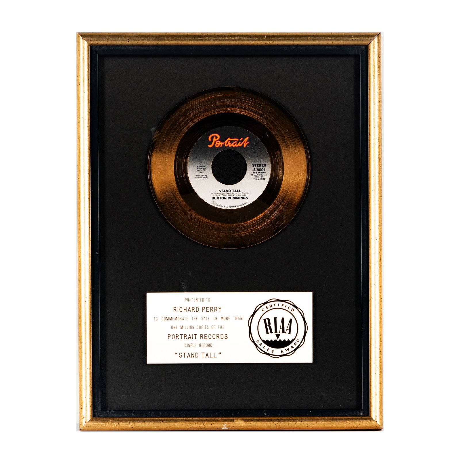 Richard Perry's Gold Record Burton Cummings 'Stand Tall': Framed RIAA Certified Sales Award presented to Richard Perry for the sale of over one million copies of the Portrait Records single 'Stand Tall' by Burton Cummings. The award features a gold-colored v