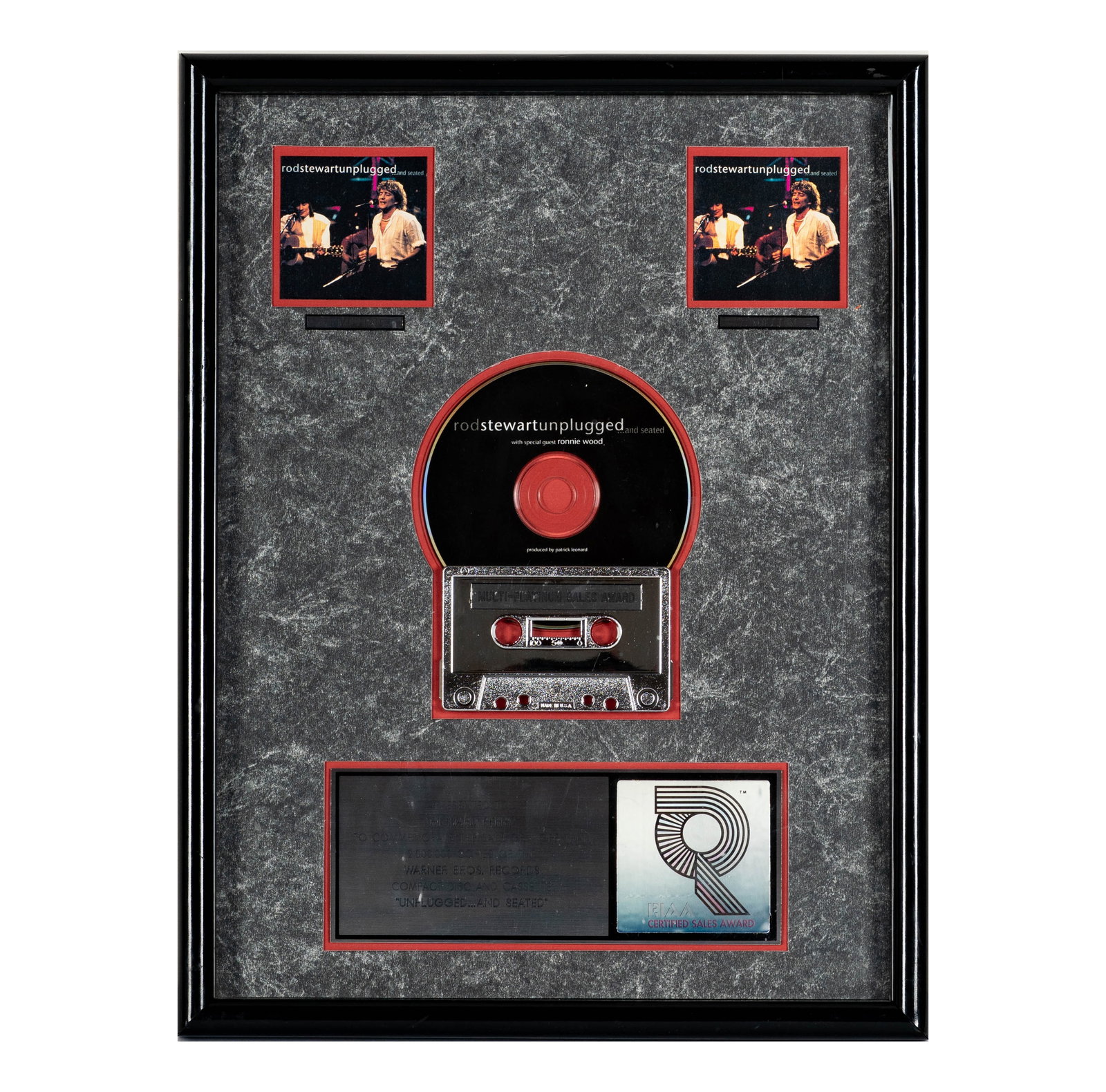 Richard Perry's Multi-Platinum Award Rod Stewart 'Unplugged...and Seated': This framed award commemorates the sale of over 2,000,000 copies of Rod Stewart's 'Unplugged...and Seated' album. It features two images of the performance, a CD, a cassette tape, and a RIAA Certified
