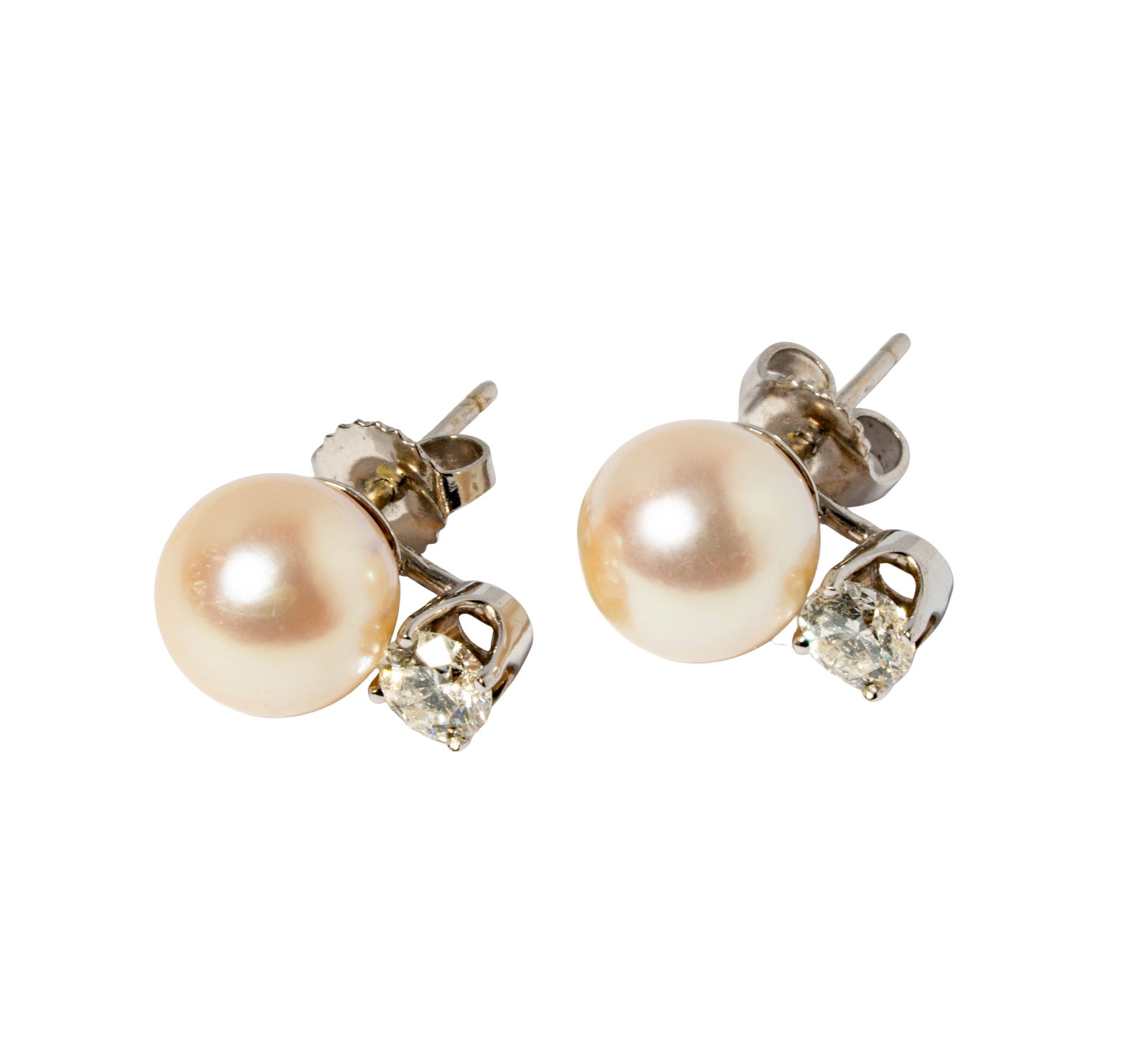 Pair of 18 Karat White Gold Pearl and Diamond Earrings: Including one pair of 18 karat white gold earrings, set with round southsea pearls measuring approximately 9mm in diameter and accented with two small round full-cut diamonds [I/SI] weighing approxima