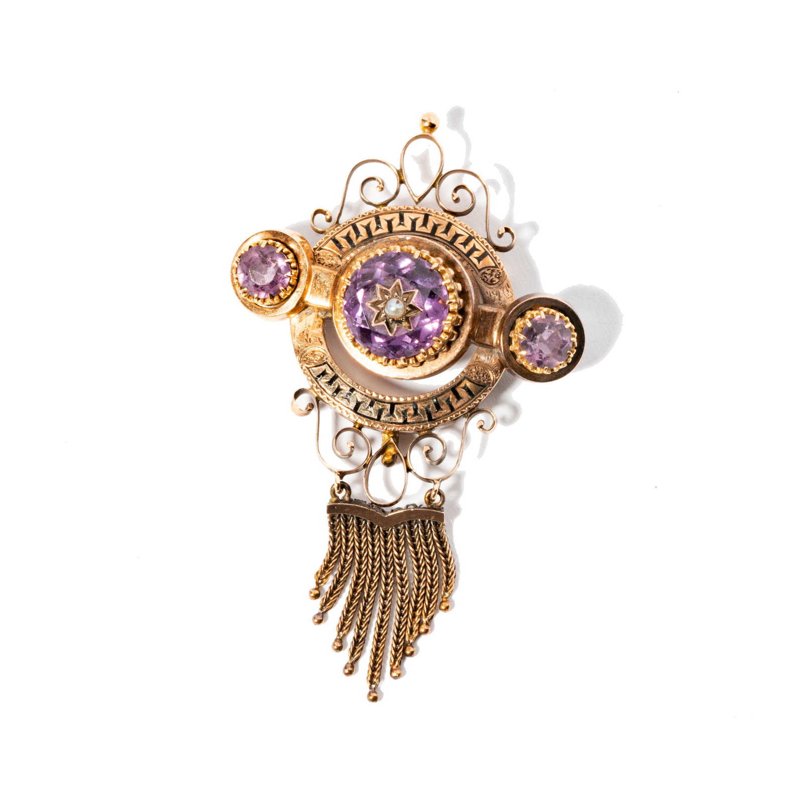 14 Karat Rose Gold, Amethyst, Pearl, and Enamel Brooch: 14 Karat Rose Gold, Amethyst, Pearl, and Enamel Brooch including one brooch set with three round amethysts and one pearl; measuring 69.50mm tall by 42.54mm wide, weighing 13.1 grams;