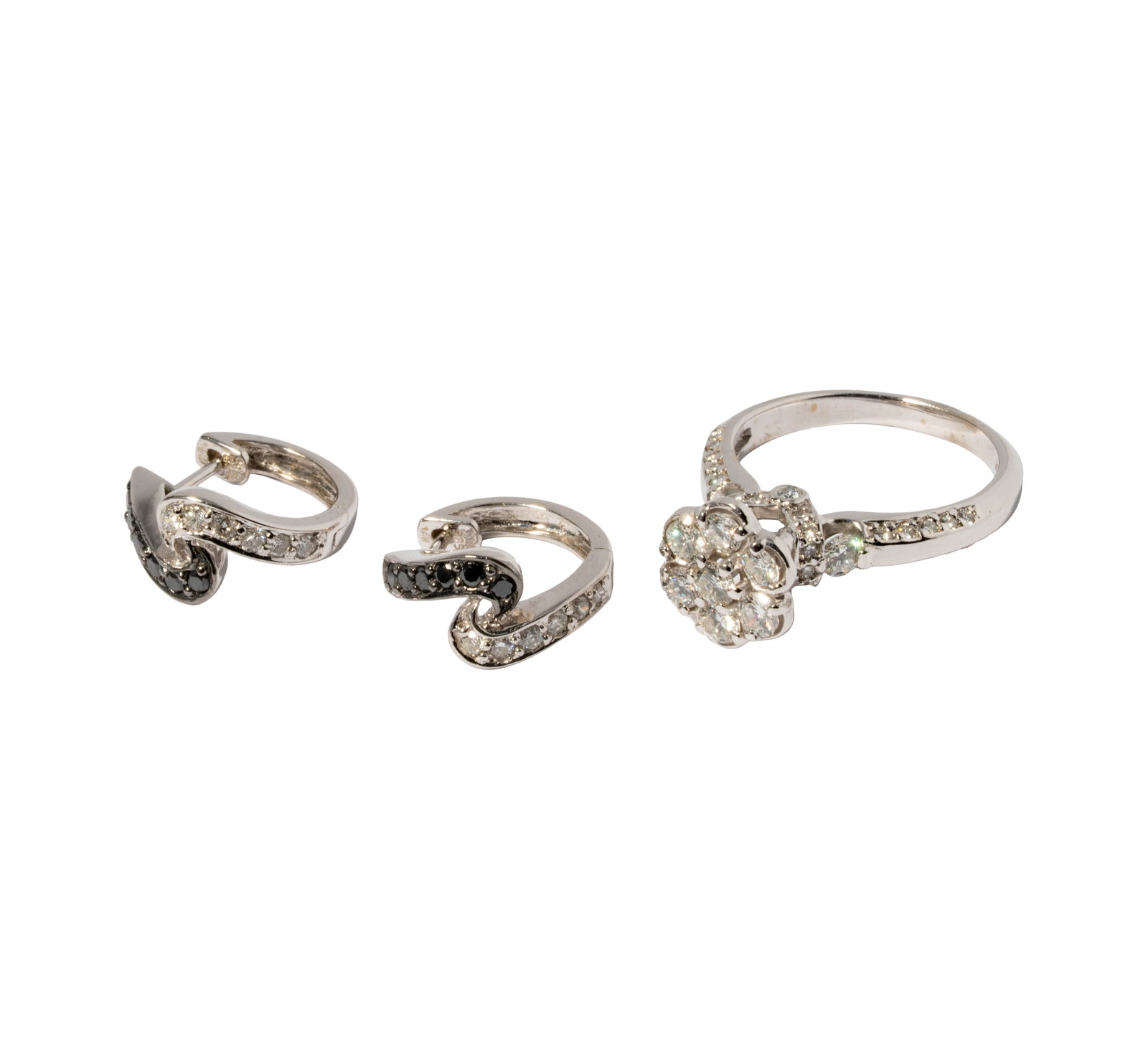 14 Karat White Gold Diamond Flower Ring With Earrings: Including one 14 karat white gold diamond flower ring, set with 43 diamonds [G-I/SI] together weighing 1.35 carats, ring size: 7-3/4; one pair of 14 karat white gold diamond hoops set with 12 multicol