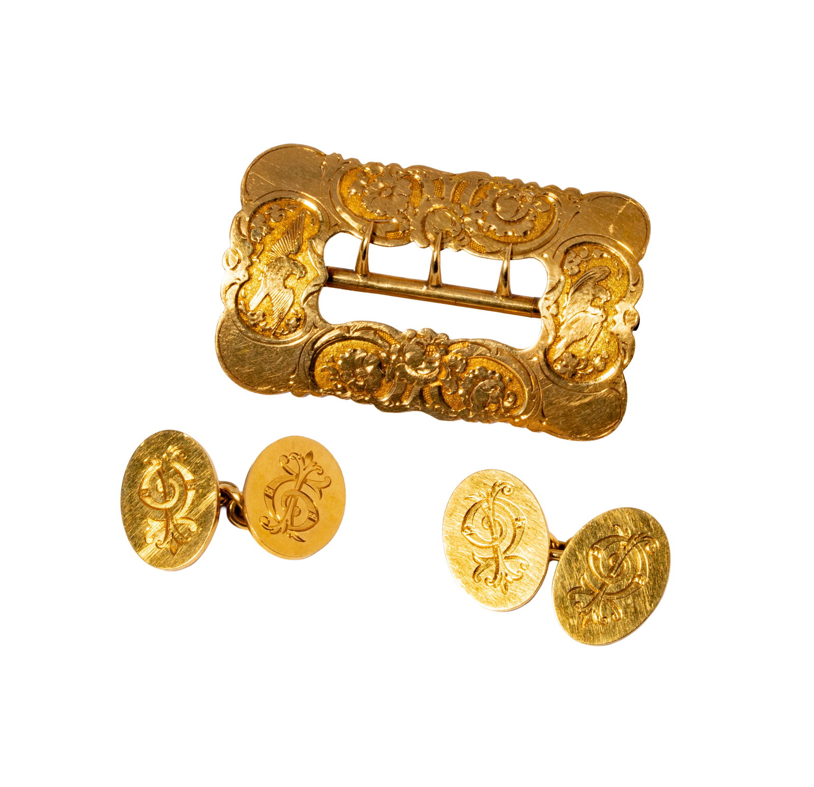 Yellow Gold Buckle and Cufflinks: Including one pair of 18 karat yellow gold cufflinks weighing 19.3 grams, and one 14 karat yellow gold belt buckle weighing 14.6 grams;