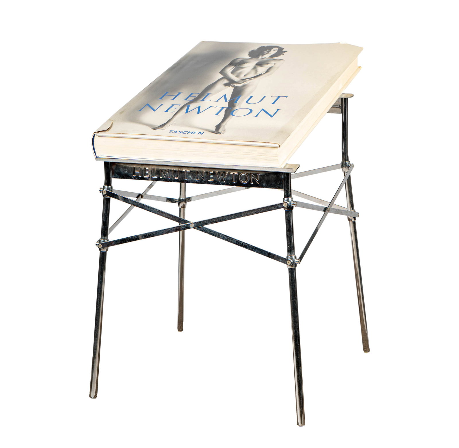 Helmut Newton and Phiippe Starck: Sumo Book and Stand: Taschen, 1999, signed and numbered 3613 (of the edition of 10,000) to title page, with chrome-plated stand impressed "Helmut Newton" and "Starck", book: 28 x 20 1/4 in., stand: 30 x 21 1/2 x 21 in.