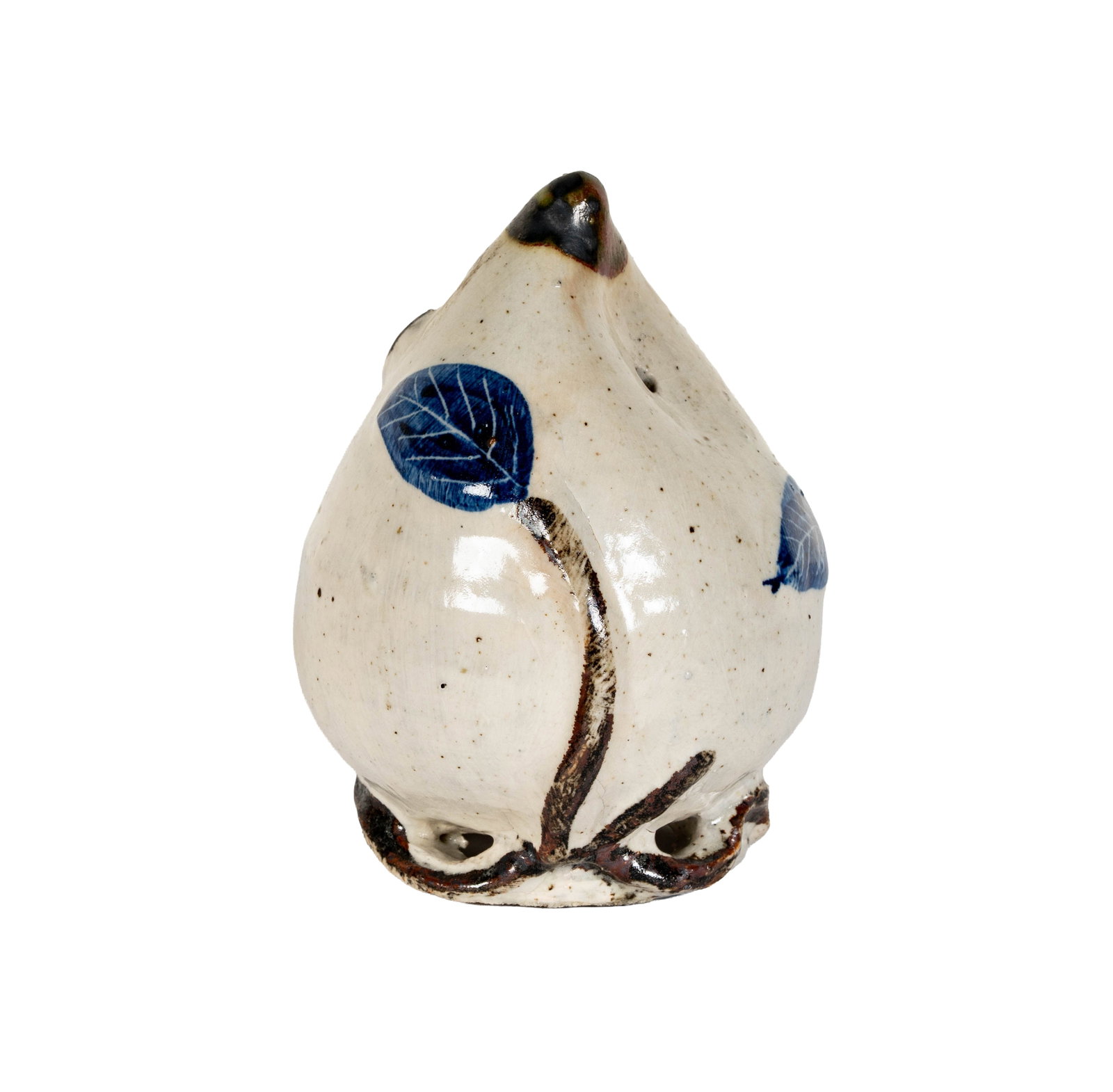 Korean Pottery Vessel with Blue Leaf Design: The piece features a white glazed body with a blue leaf design. It rests on a wooden block. 6 in