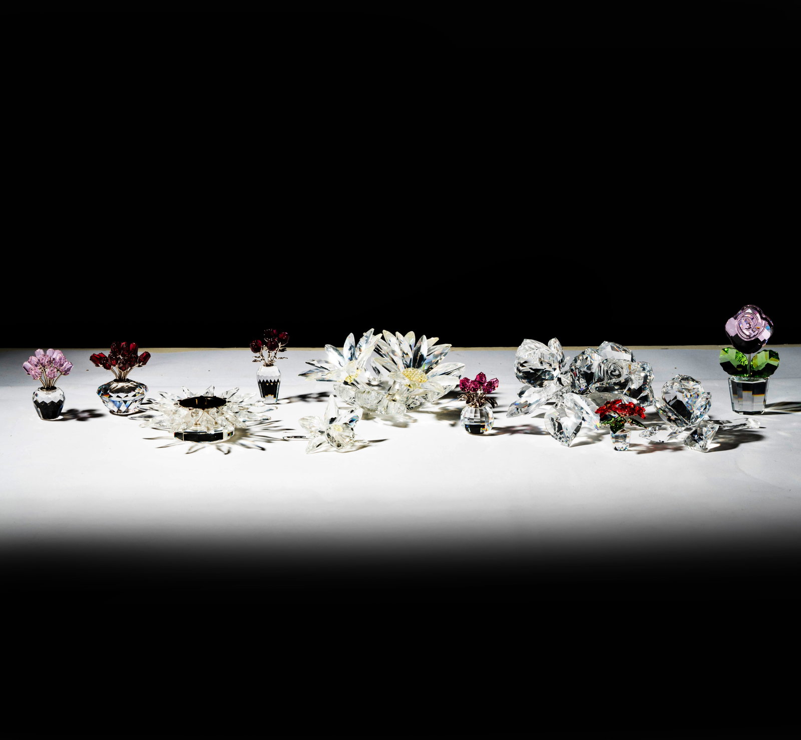 Collection of Swarovski Crystal Floral Groups: ten sculptures, yellow flower group: 2 1/2 x 6 x 6 in.