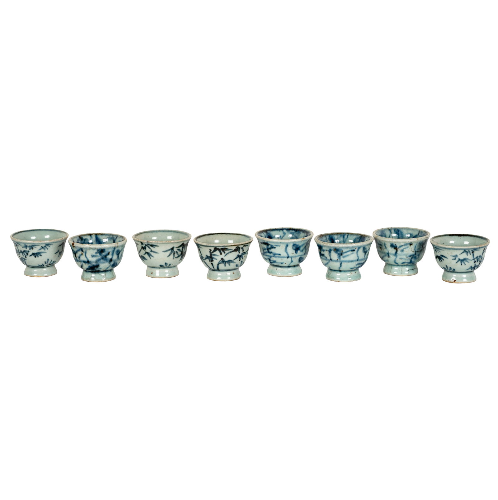 Eight Chinese Porcelain Blue and White Cups: in a fitted case, each with signature mark to underside, each cup: 1 3/4 x 2 1/4 in, the case: 3 3/4 x 14 1/2 x 6 3/4 in.