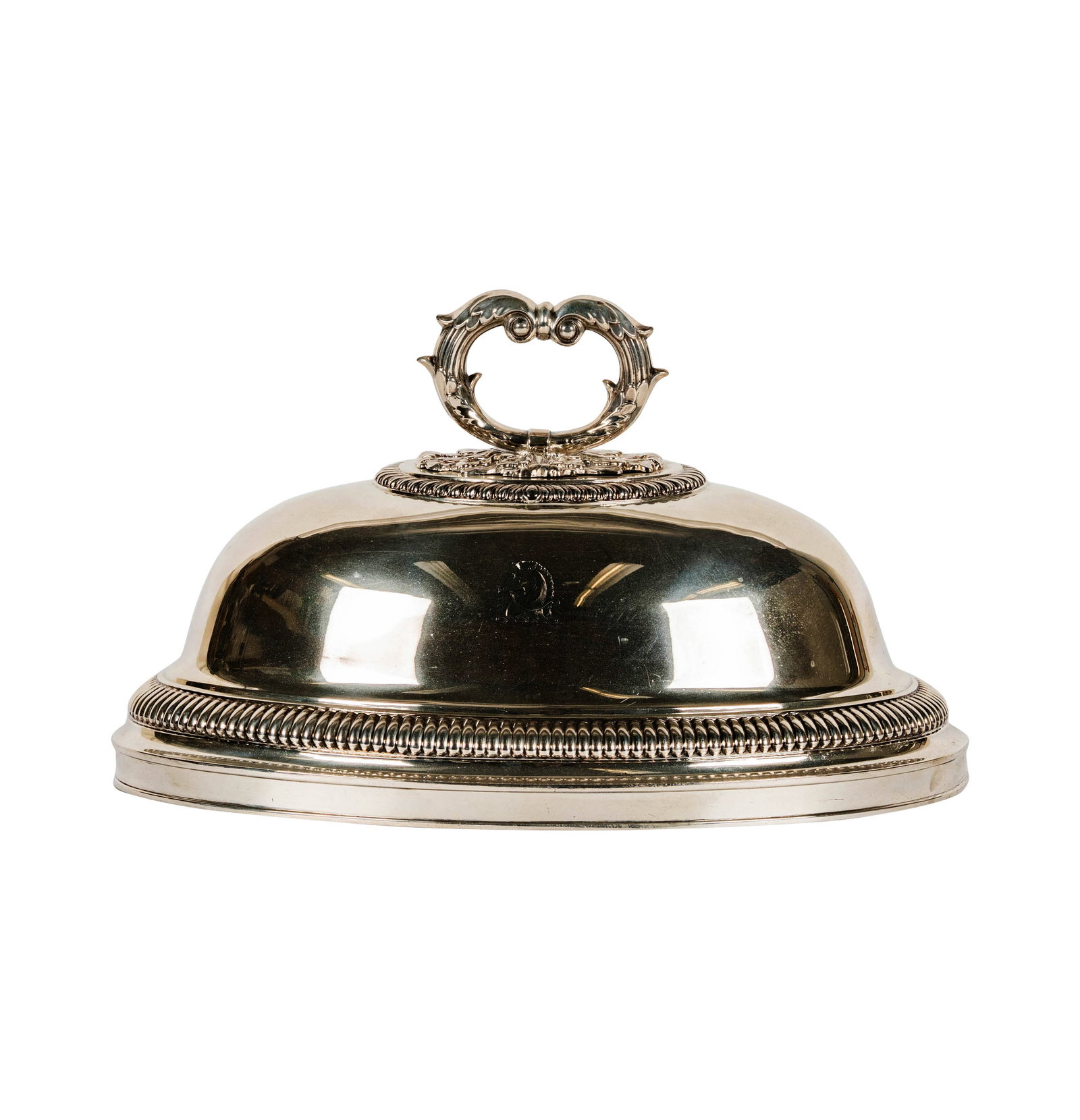 A George IV Sterling Oval Dome: Rundell, Bridge & Rundell (John Bridge), London, 1824 (marked to center of underside), engraved to one side with a heraldic crest, approximately 1,503 grams, 7 1/2 x 13 x 8 3/4 in.