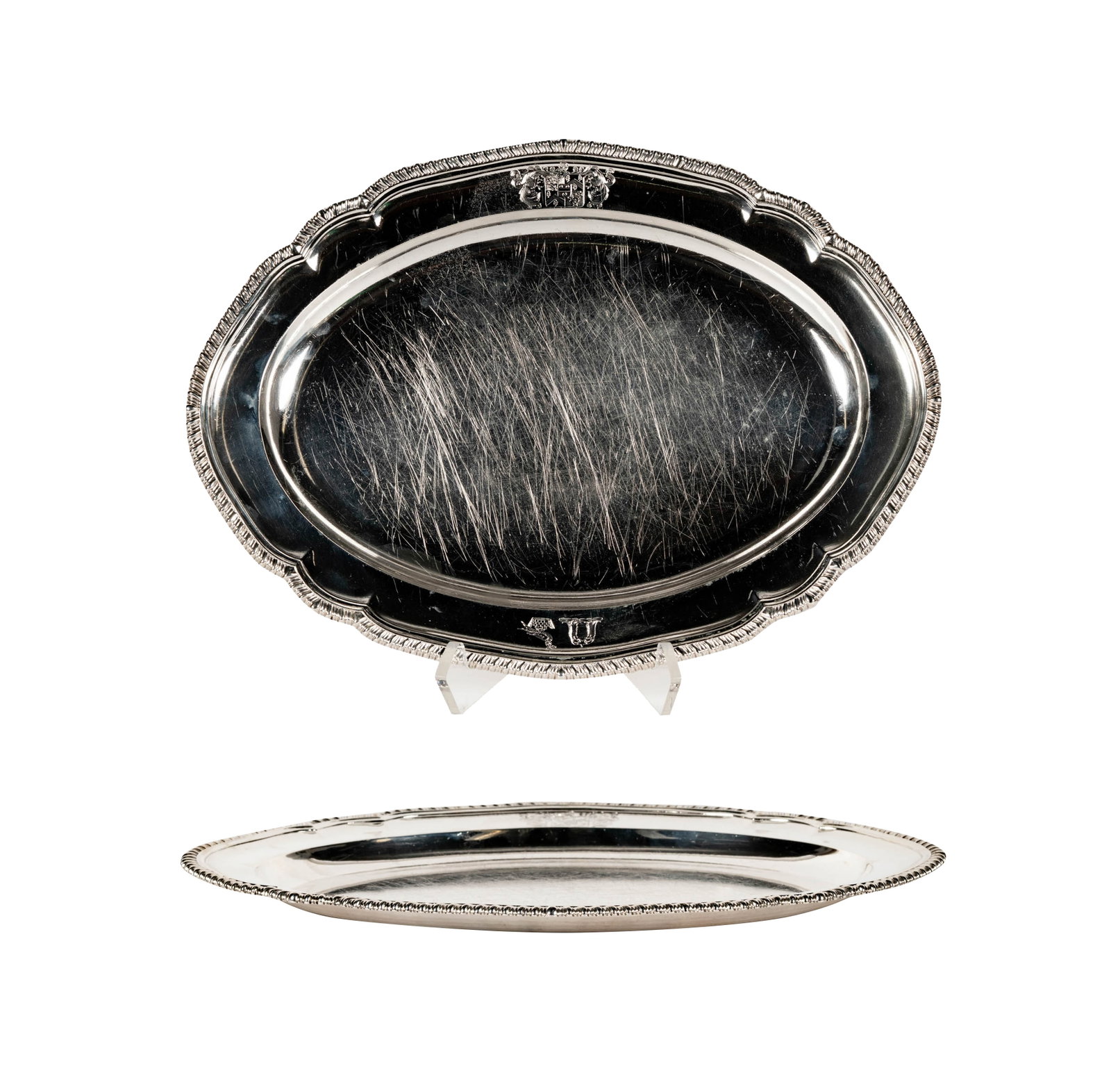 A George IV Sterling Oval Platter by Paul Storr: Paul Storr, London, 1826 (marked to underside of rim), engraved with heraldic devices, approximately 1,470 grams, 12 x 16 in.
