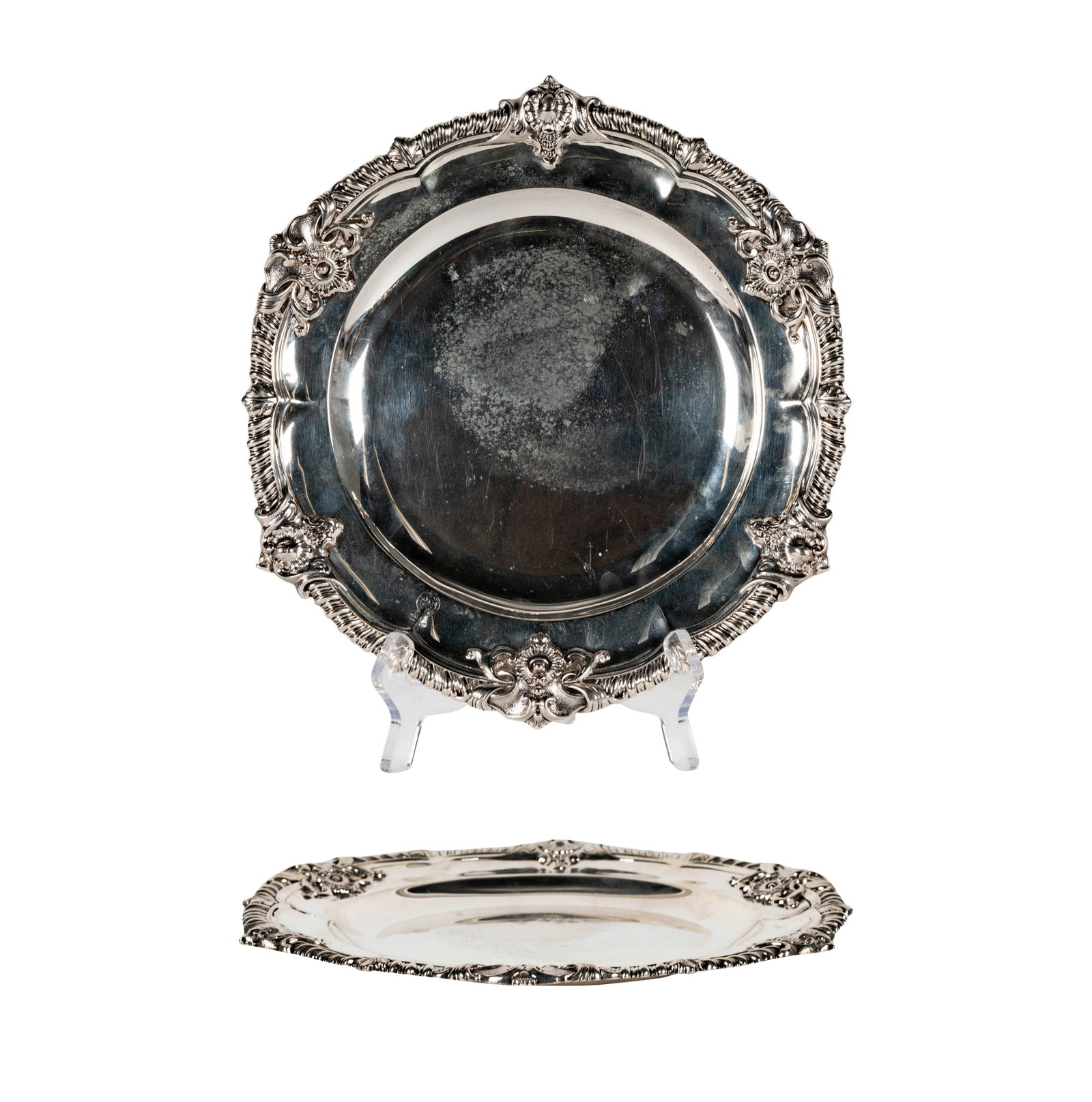 An Early Victorian Sterling Dinner Plate: William Bateman II, London, 1838, retailed by Rundell and Bridge, London; hallmarked and with retailer's inscription to underside; approximately 701 grams, 10 1/2 in. dia.