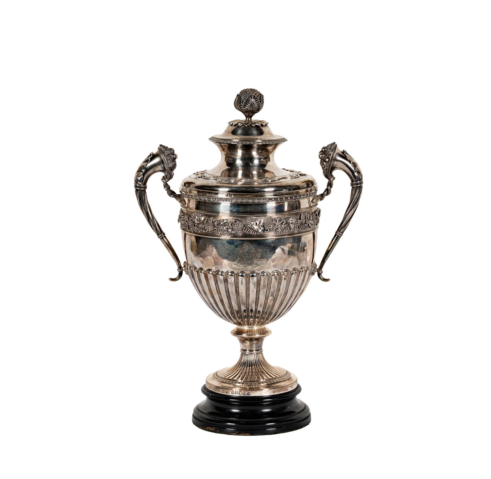 An Irish George III Sterling Two-Handled Covered Cup: James Scott, Dublin, 1809, retailed by William Hamy (marked to foot rim), the body engraved with a heraldic crest and motto "Memento Mei", 14 1/2 x 11 x 6 1/2 in., approximately 2116 grams; with a