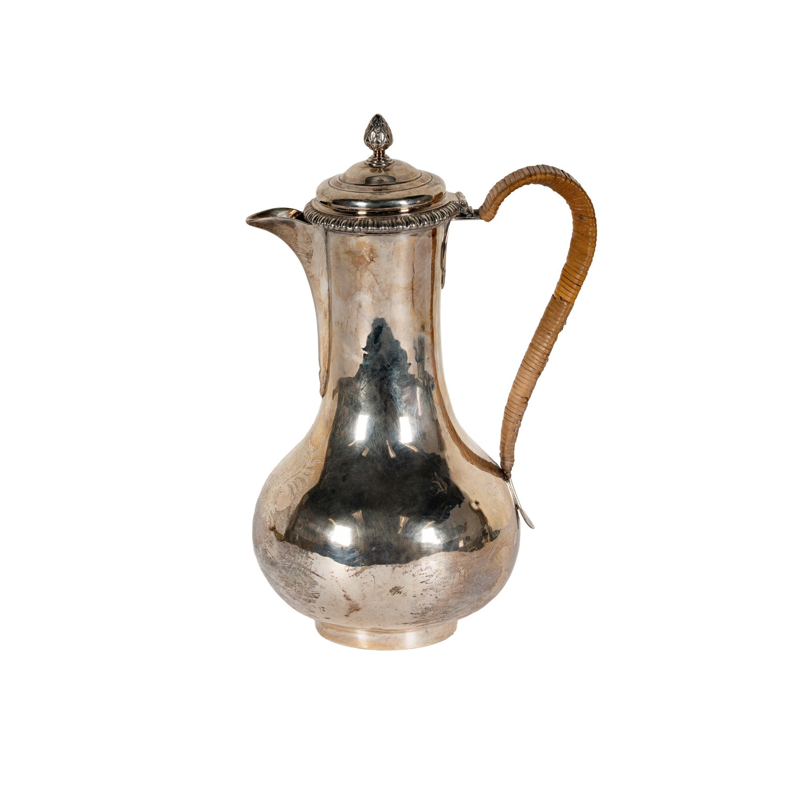 A George III Sterling Chocolate Pot by Ayme Videau: Aymé Videau, London, 1761 (marked to underside); the body engraved with a cartouche, the handle wrapped with raffia; approximately 597 grams gross, 9 1/4 in. high