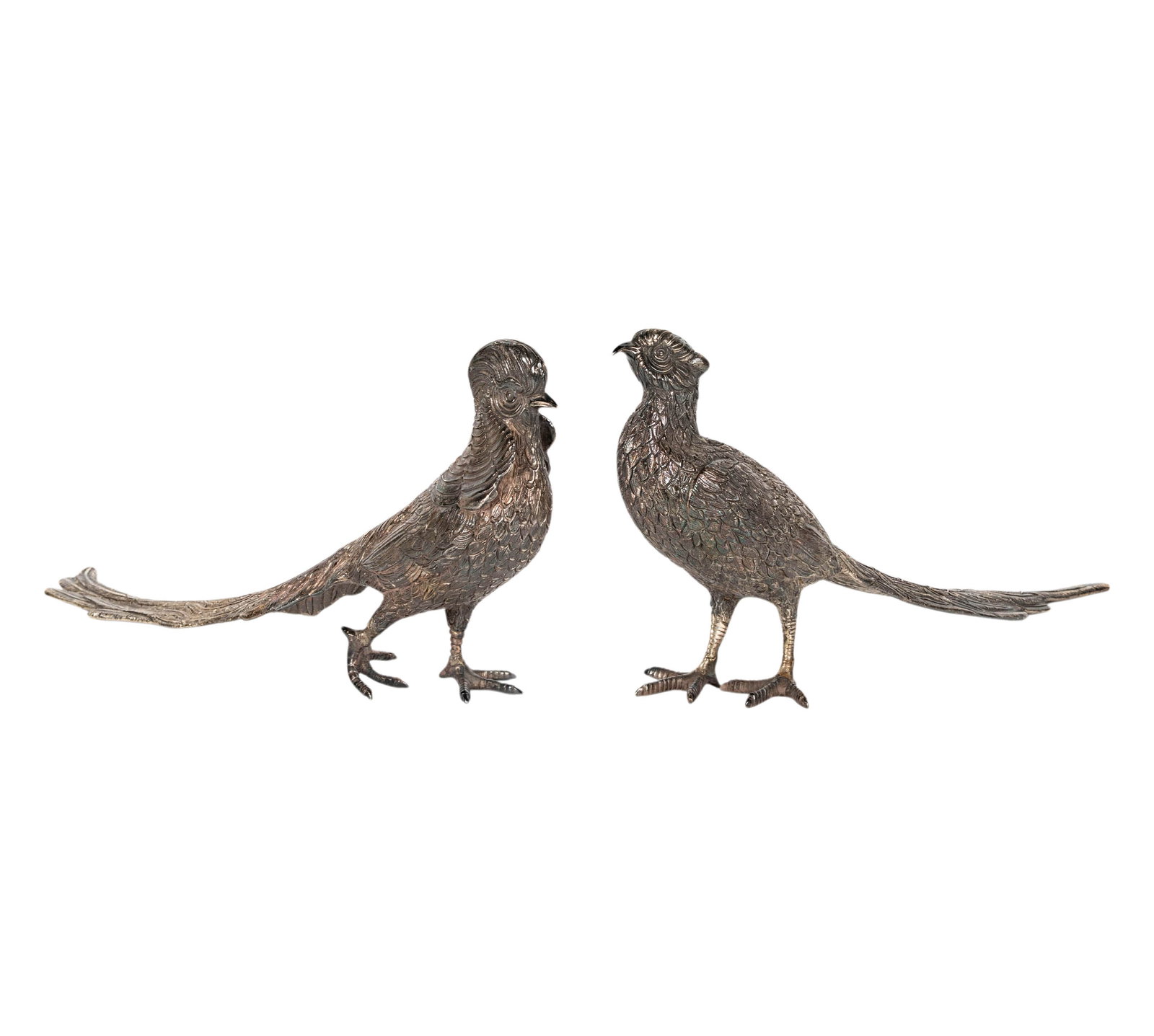A Pair of Sterling Pheasant Figures: each marked ".925", approximately 1,961 grams total, each 6 1/4 x 12 in.,