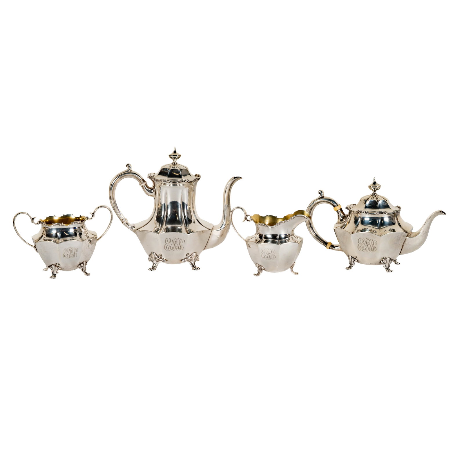 A Black, Starr and Frost Sterling Coffee and Tea Service: New York, NY, comprising a teapot (5 in. high), a coffee pot (6 3/4 in. high), an open sugar with gilt-washed interior (3 1/2 in. high), and a creamer with gilt-washed interior (3 1/2 in. high), each 