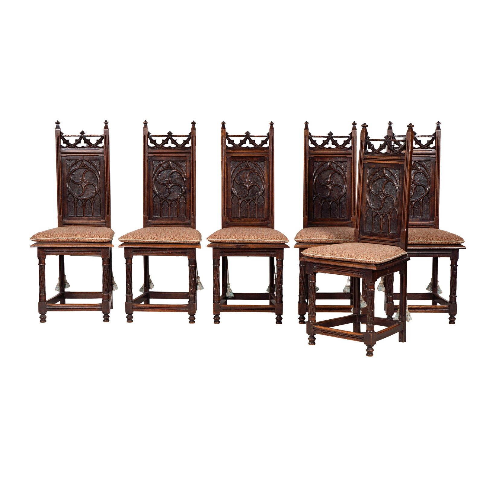 A Set of Six Narrow Gothic Carved Oak Dining Chairs: 44 x 18 x 16 in., seat height: 18 in.