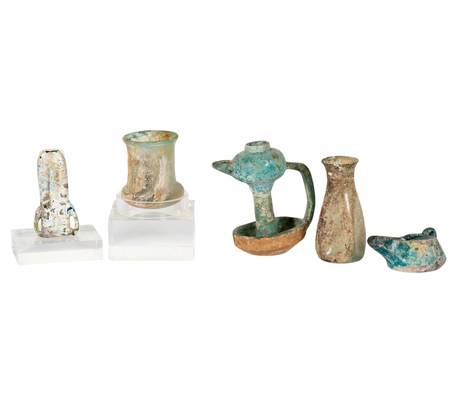 A Collection of Antiquities: comprising a Syrian bottle, a Greco-Roman bottle, two Byzantine oil lamps, and an amphora glass bottle, large oil lamp: 5.5 x 4 x 3.5 in. Property from a Beverly Hills Estate, Philips and Harris, Lond