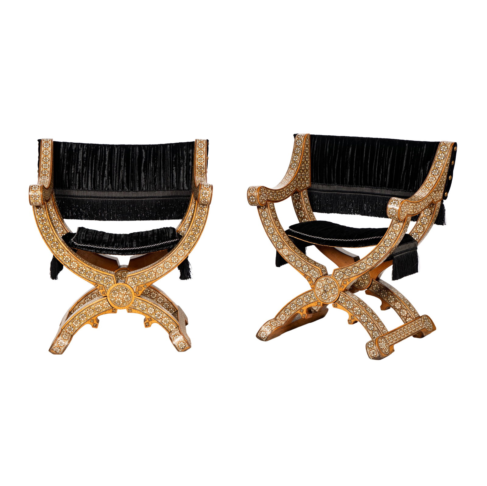 A Very Rare Pair of Nasrid or Post-Nasrid Taracea Chairs: Each with a curving X-frame and scrolling arms resting on splayed stretchers, the surface inlaid with silver, hardwood, and bone in a fine geometric design composed of floral roundels interspersed wit
