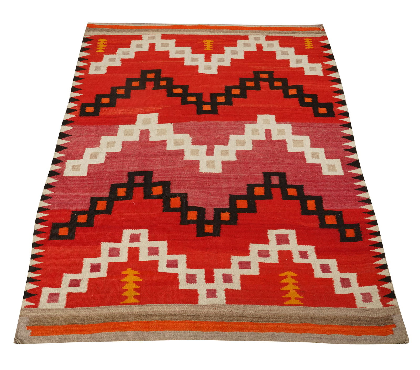 A Navajo Red Background Blanket: 19th century, featuring five bands of ascending and descending diagonals of connected square blocks in white and black; squares with gray, orange, or mauve centers; five sets of stacked mustard-yellow