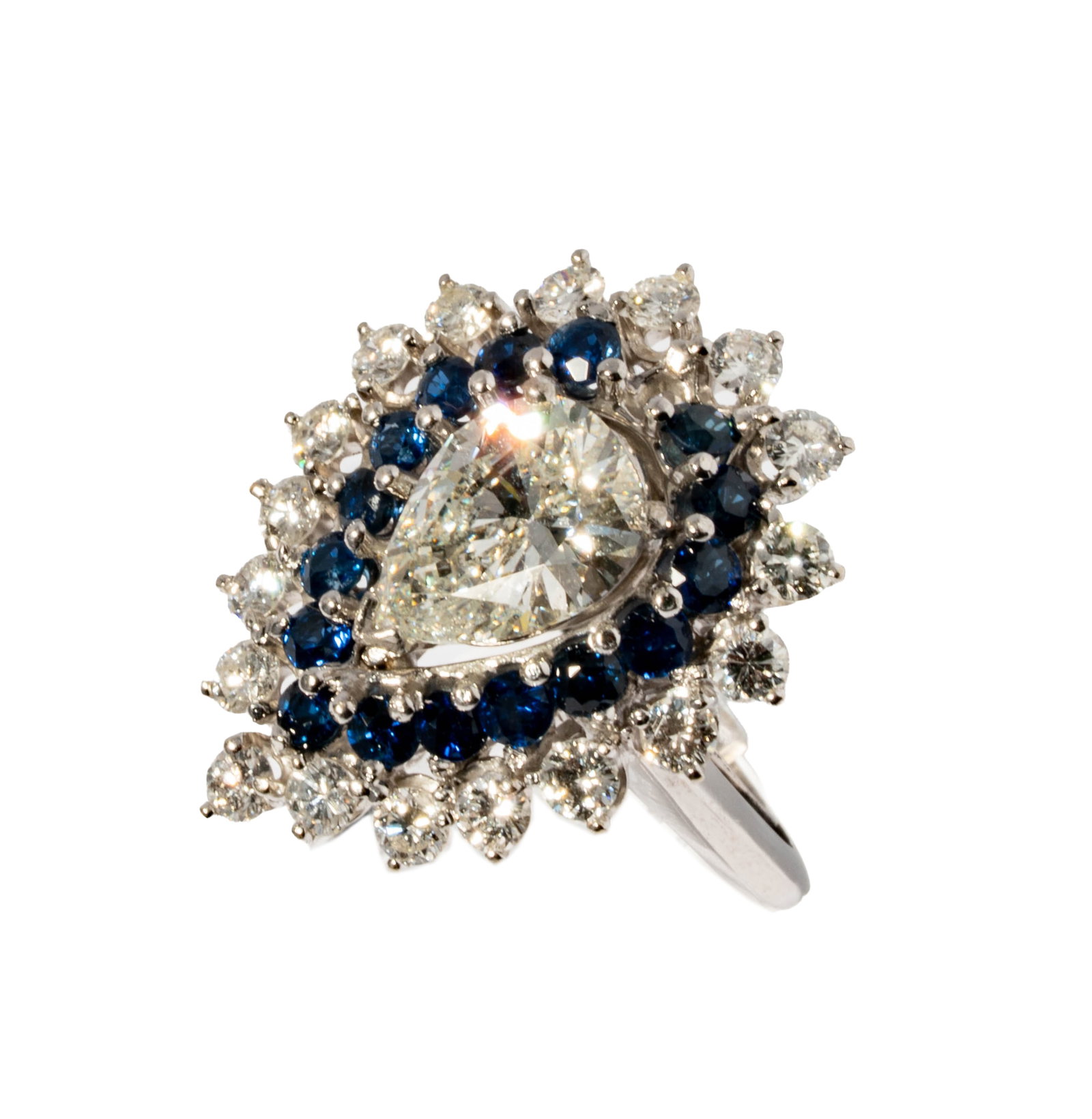 14 Karat White Gold Diamond and Sapphire Ring: Including one 14 karat white gold and diamond sapphire ring set with one large pear-shaped diamond [H-I/SI3] weighing 1.75 carats, and accented with 18 small full-cut diamonds [H-I/SI] weighing approx