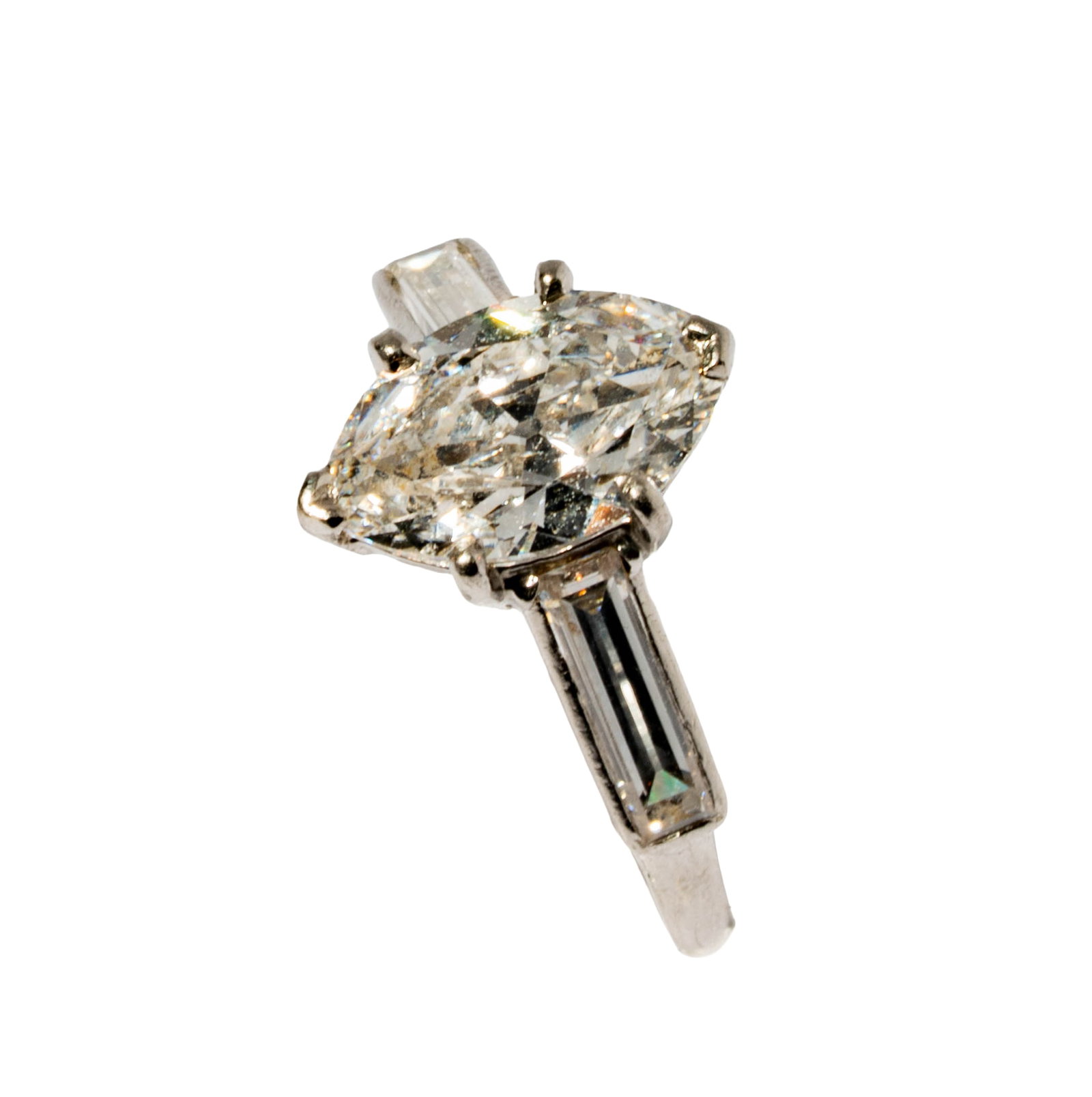 Platinum Diamond Ring: Including one platinum diamond ring set with one old-mine cut marquise diamond [F-G/SI2] weighing approximately 1.15 carats, and accented with two elongated baguettes [G-H/VS2] weighing approximately
