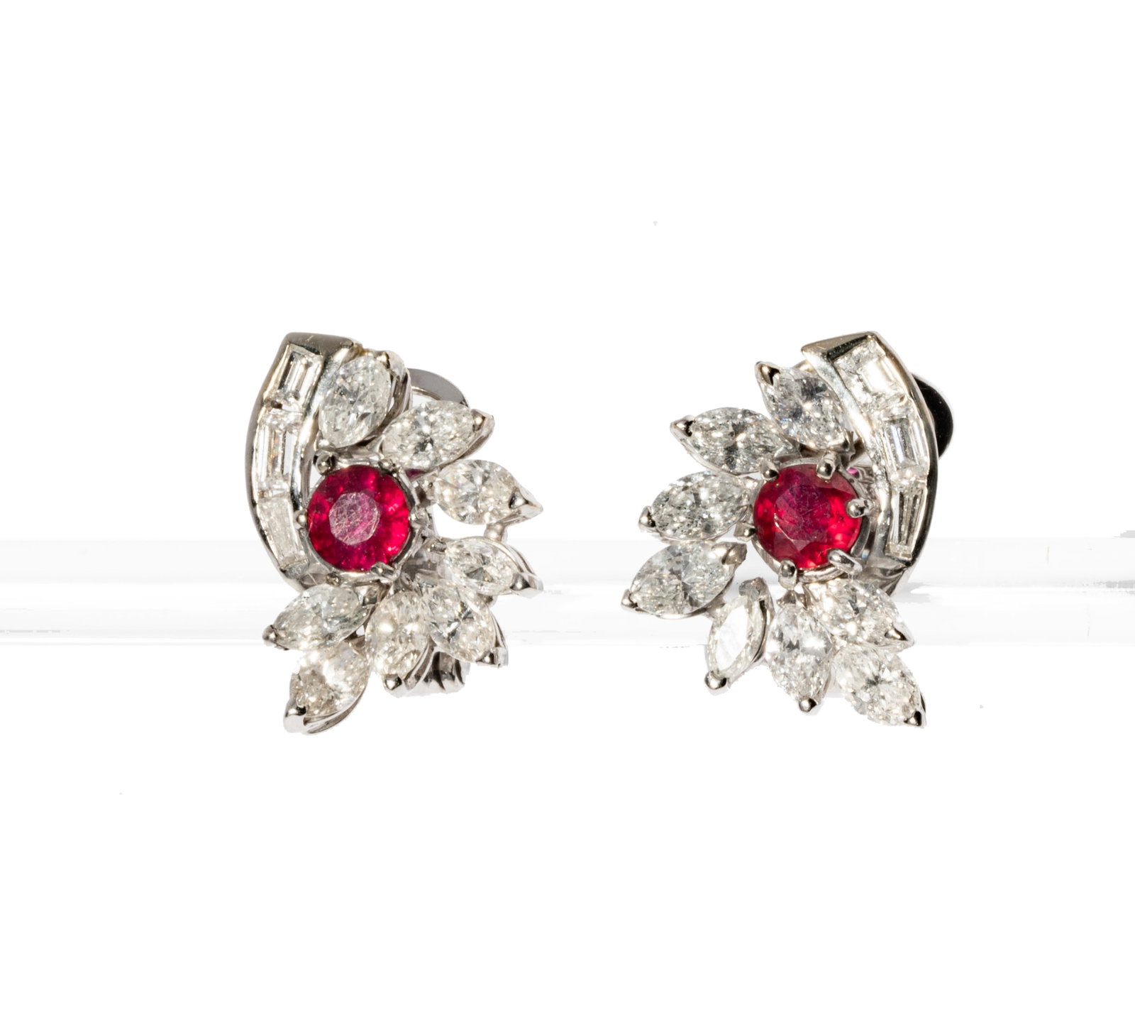 Platinum, Ruby and Diamond Earrings: Platinum, Ruby and Diamond Earrings set with two round rubies weighing approximately 0.88 carats, and accented with 22 mixed-cut diamonds [G-H/VS-SI] weighing approximately 3.4 carats; measuring 19.19