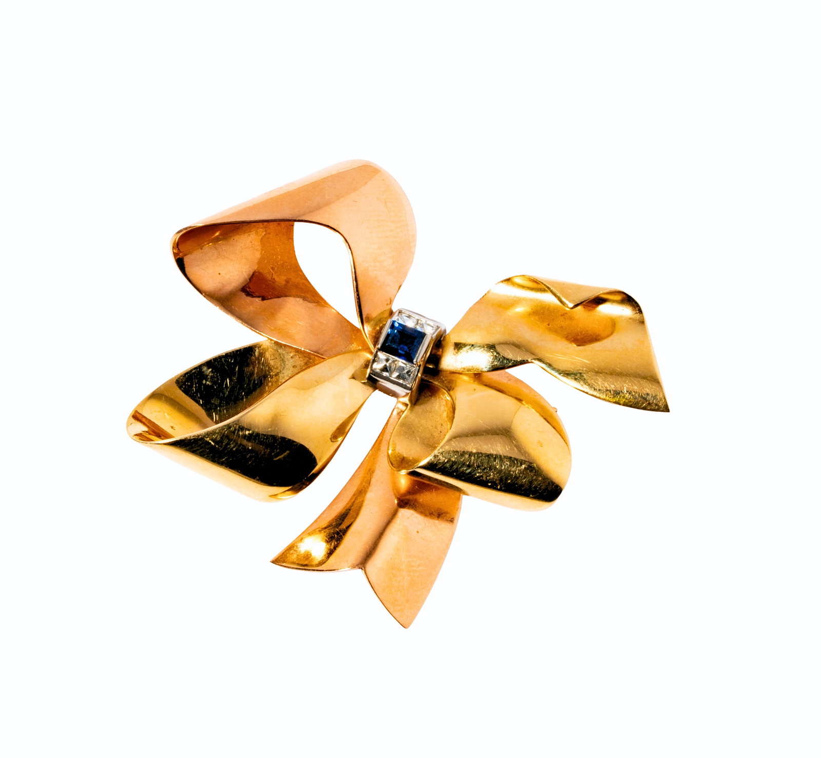 Cartier, 14 Karat Gold, Diamond and Sapphire Bow brooch: Including one Cartier 14 karat tri-color gold, sapphire, and diamond bow brooch, set with one rectangular step-cut sapphire weighing approximately 0.30 carats and four french-cut diamonds [H-I/VVS] we
