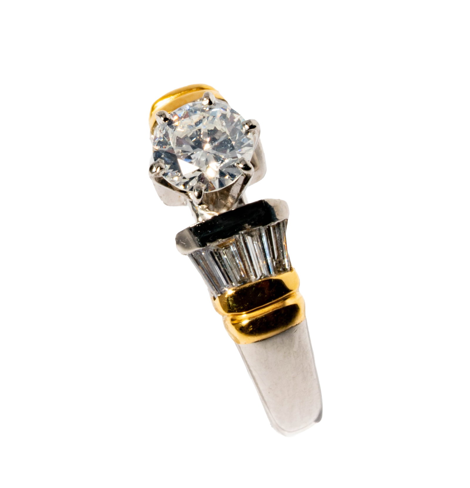 One Platinum, 18 Karat Diamond Ring: Including one platinum, 18 karat yellow gold diamond ring, centering one round brilliant diamond [G-I/SI] weighing approximately 0.60 carats, and accented with eight tapered baguette diamonds weighing