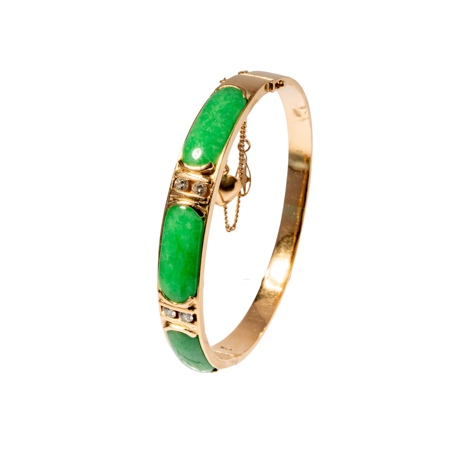 18 Karat Yellow Gold, Jade, and Diamond Bangle: Including one 18 karat yellow gold diamond and jade bangle, set with four round full-cut diamonds weighing approximately 0.30 carats, and set with three cabochon jade; bracelet measuring 6-15/16 inche