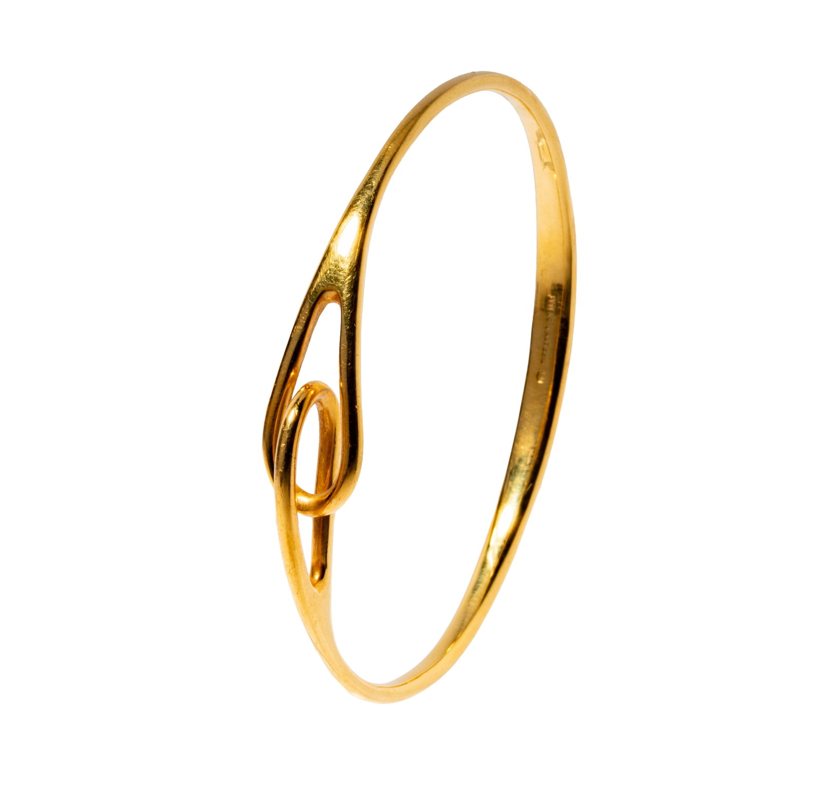 Vintage Tiffany and Co. 18 Karat Yellow Gold Bangle Bracelet: Including one Tiffany & Co. 18 karat yellow gold interlocking bangle bracelet, measuring 7-1/4 inches inside, and weighing 23.7 grams;