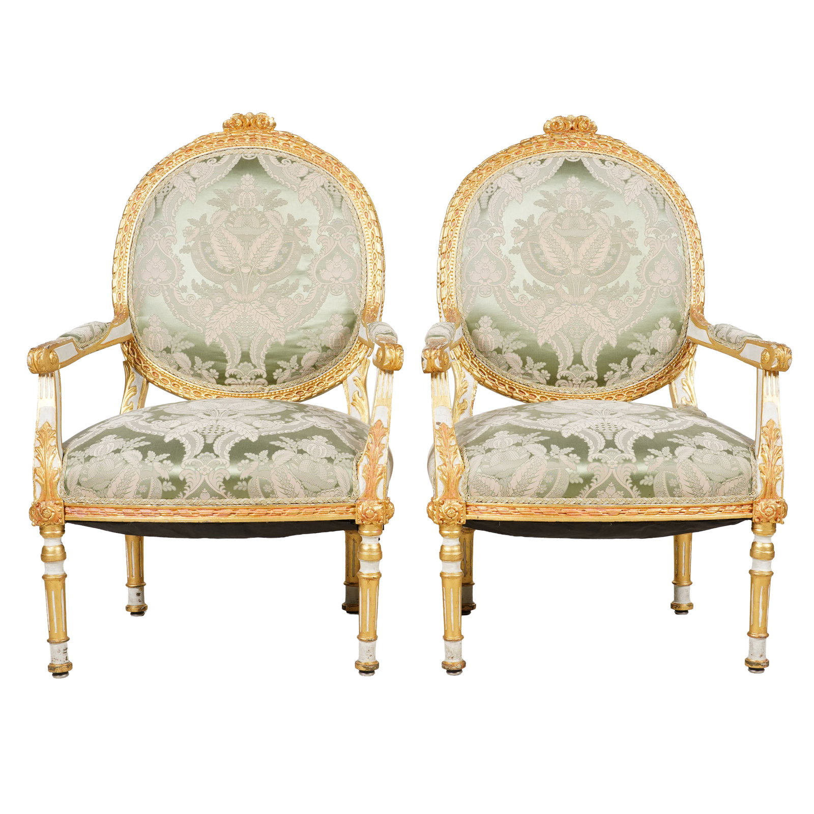 Pair of Louis XVI-Style Gilt and White-Painted Fauteuils: each covered with green damask fabric, 38 1/2 x 25 x 22 in. seat height: 16 in.