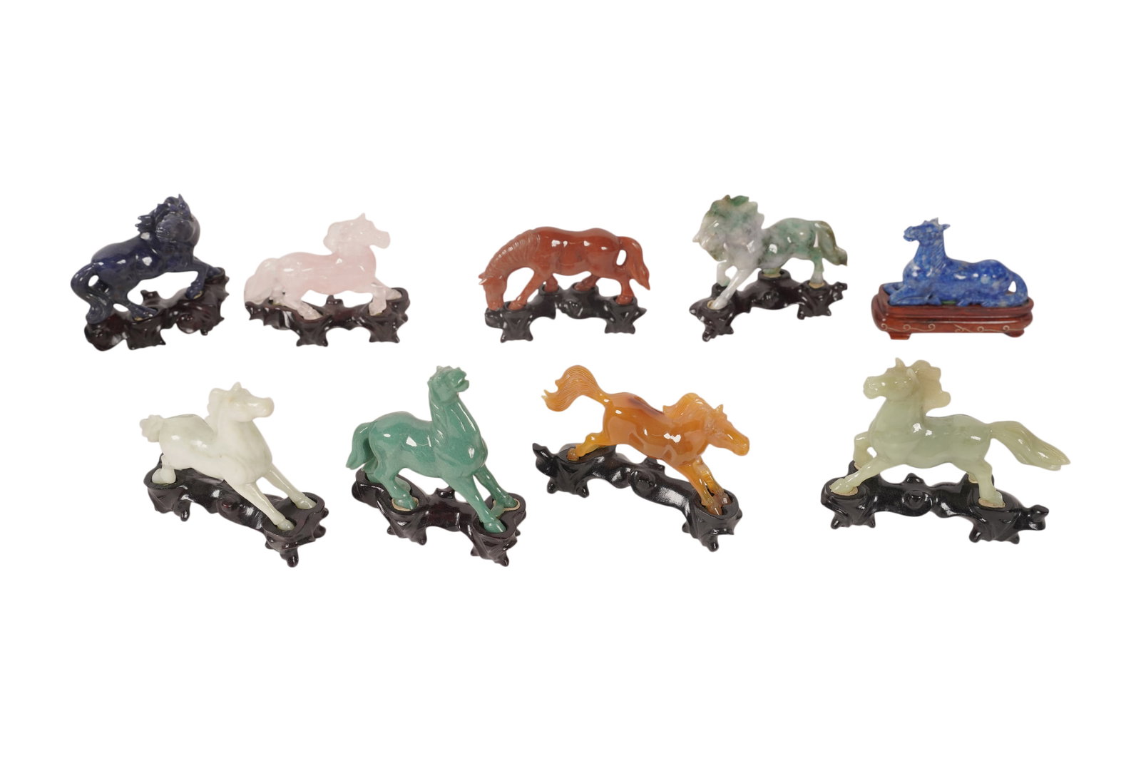 Nine Assorted Jade and Stone Horses: In fitted silk box, figures: 3 1/2 x 3 x 1 in., box: 6 x 11 1/2 x 11 3/4 in.