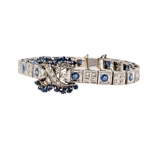 Platinum Diamond and Sapphire Bracelet: Buyer's Premium is 25% on Abell.com Buyer's Premium is 28% on Liveauctioneers.com Including one platinum, diamond and sapphire bracelet, bracelet set with 55 small round diamonds weighing approximatel
