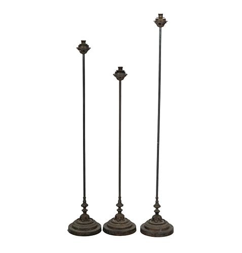 Three Tall Bronze Candlesticks: Buyer's Premium is 25% on Abell.com Buyer's Premium is 28% on Liveauctioneers.com tallest: 50 1/2 in.