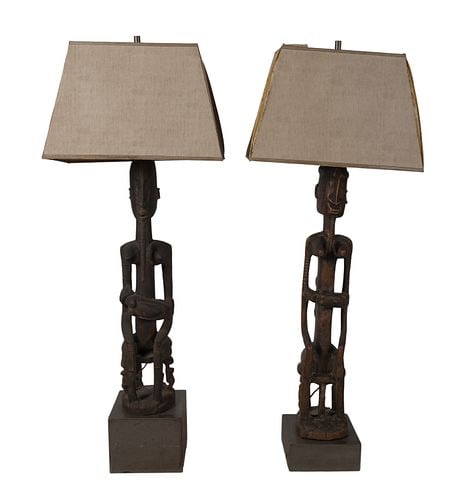Pair of African Carvings Mounted as Lamps: Buyer's Premium is 25% on Abell.com Buyer's Premium is 28% on Liveauctioneers.com 57 in. tall