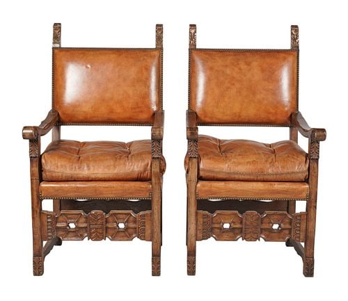 A Pair of Spanish style Walnut and Leather Hall Chairs: Buyer's Premium is 25% on Abell.com Buyer's Premium is 28% on Liveauctioneers.com 52 x 26 1/2 x 25 1/2 in., seat height: 24 in.