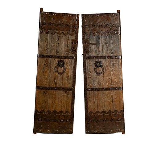 Pair of Rustic Metal-Clad Doors: Buyer's Premium is 25% on Abell.com Buyer's Premium is 28% on Liveauctioneers.com 78 x 25 in.