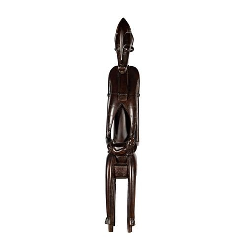 Large Carved Wood African Sculpture: Buyer's Premium is 25% on Abell.com Buyer's Premium is 28% on Liveauctioneers.com 58 x 9 1/4 x 10 in.