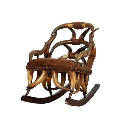 A Childs' Rocking Chair Created from Steer Horns: Buyer's Premium is 25% on Abell.com Buyer's Premium is 28% on Liveauctioneers.com With suede upholstered seat, 27 h x 16 w x 31 d, seat h 15 ins.