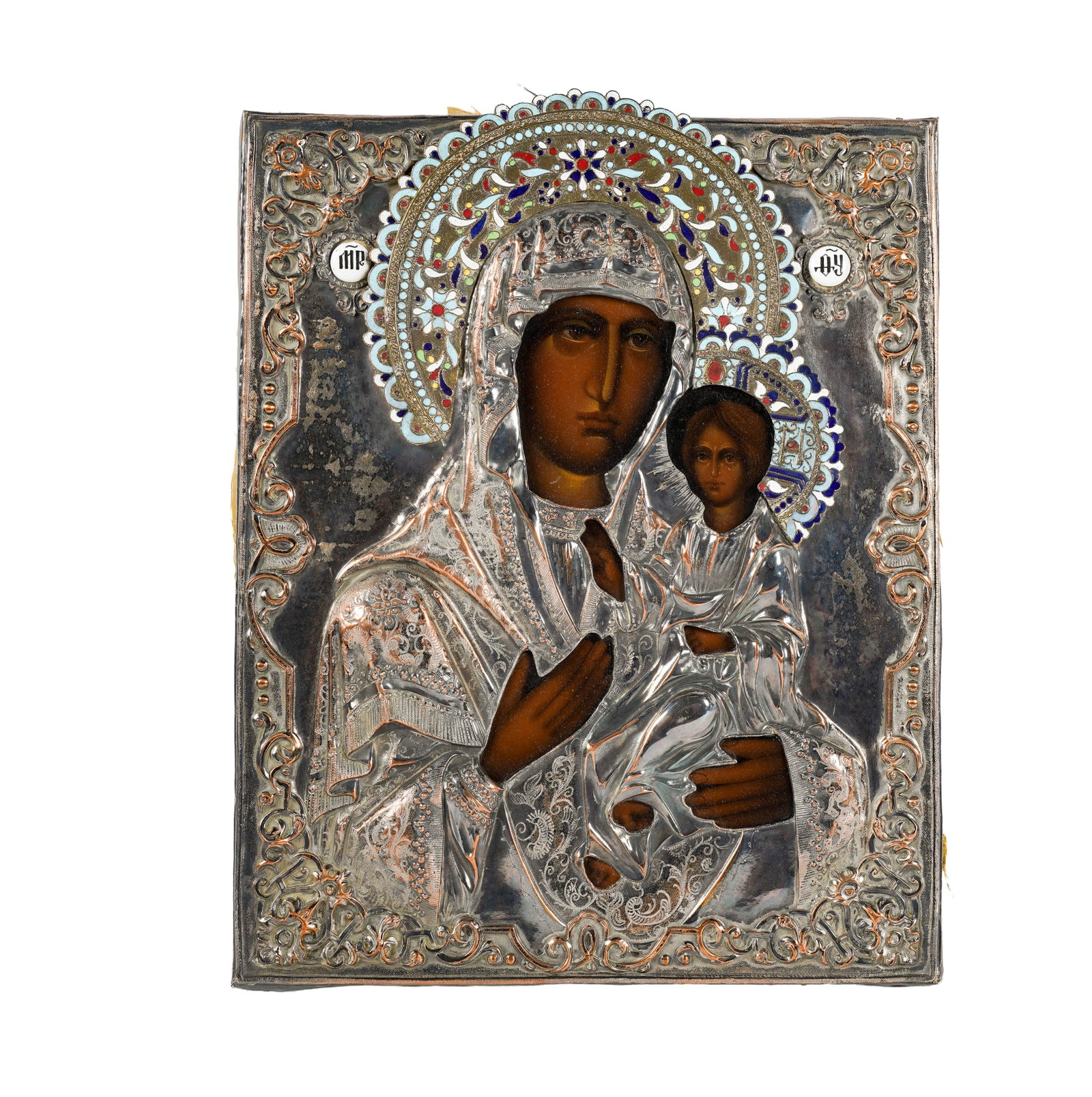 A Russian Enameled Brass Icon of Madonna and Child: stamped MET to lower edge 12 x 9 3/4 in. (30.5 x 24.8 cm.)